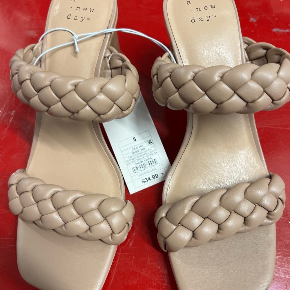 Tan brown sandal with heel size 8.